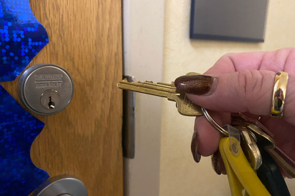 Employee using a door key
